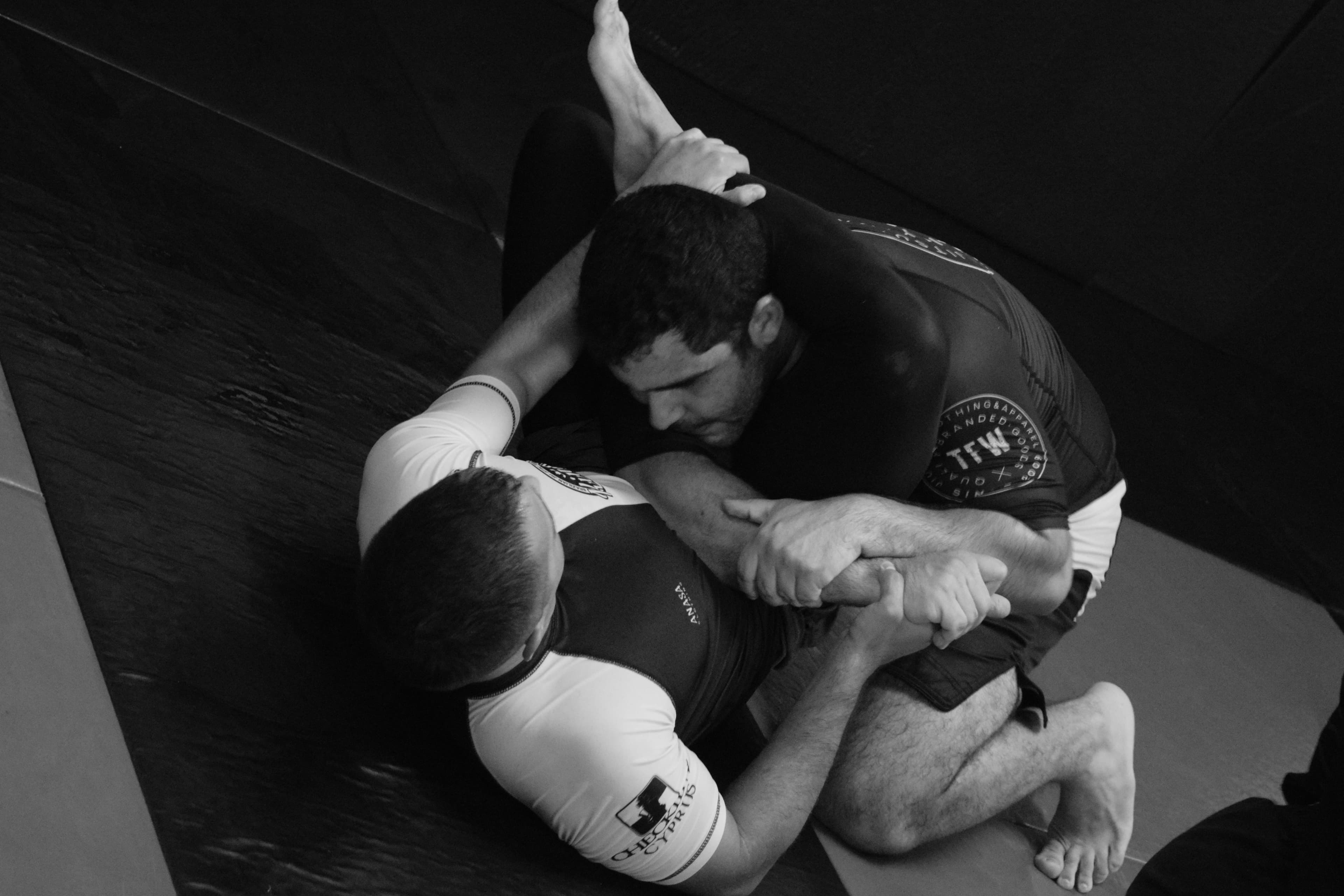 BJJ practitioners executing a triangle choke during training at our BJJ gym in Cyprus.