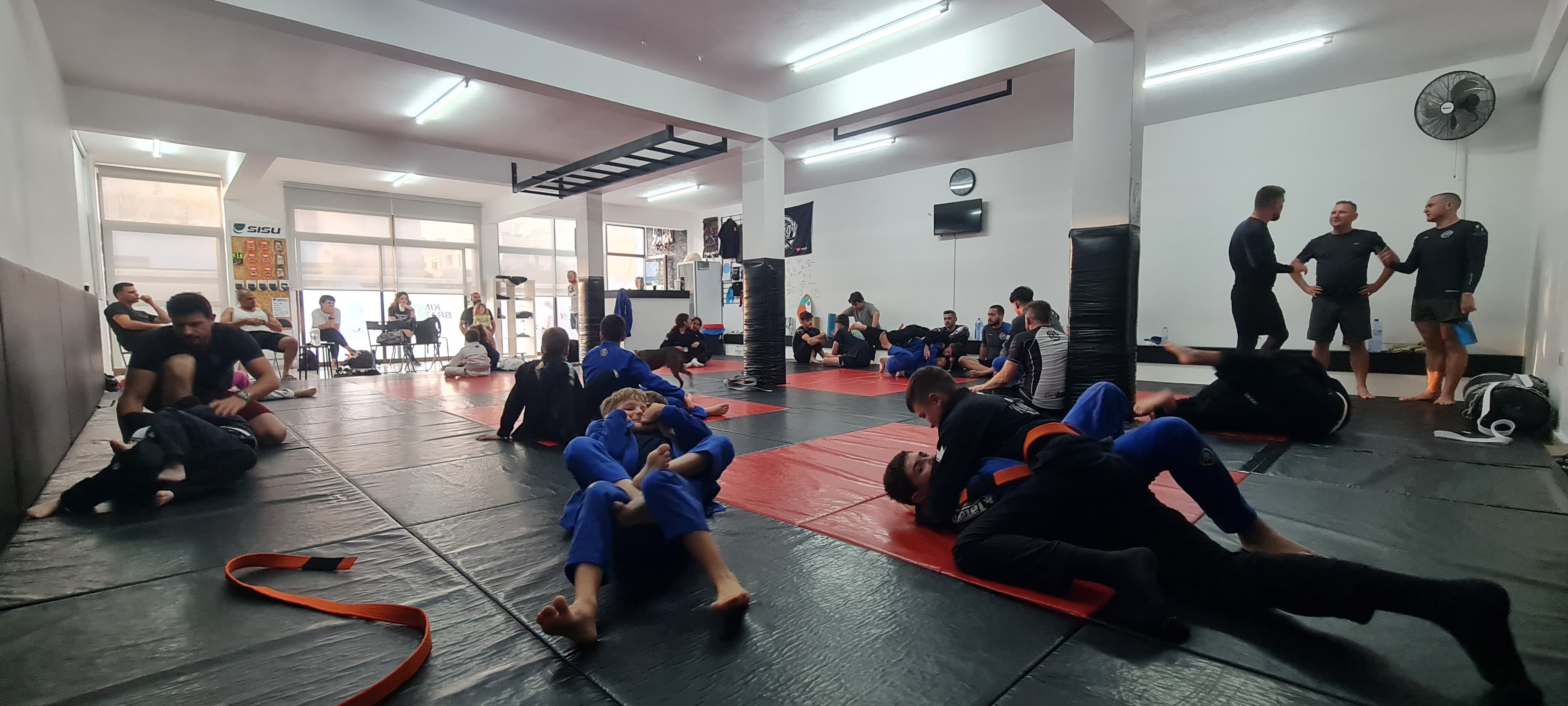 Members of our BJJ community in Paphos, Cyprus, posing as a team, showcasing our BJJ academy's camaraderie and unity.